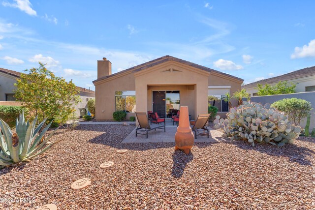 back of property featuring a patio area