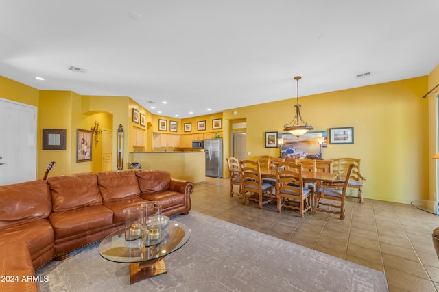 living room with light tile patterned floors