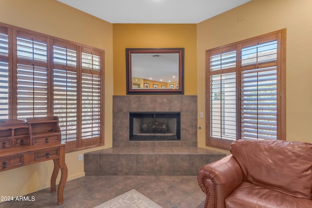 tiled living room featuring a tile fireplace