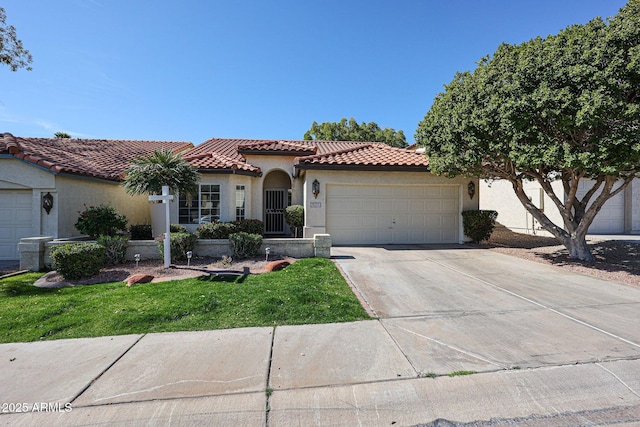 mediterranean / spanish-style home with stucco siding, concrete driveway, a tile roof, and a garage