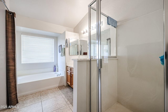 full bath featuring tile patterned floors, a shower stall, vanity, and a garden tub