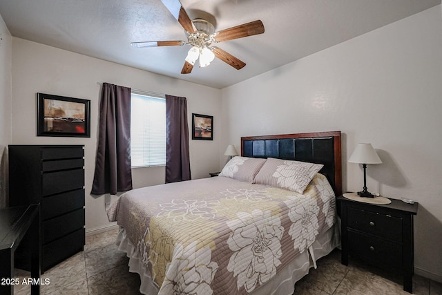 bedroom with baseboards and a ceiling fan