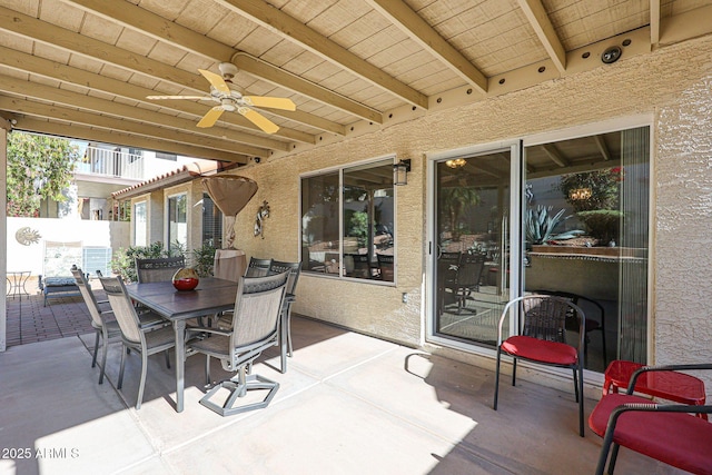 view of patio / terrace featuring a ceiling fan, outdoor dining area, and fence