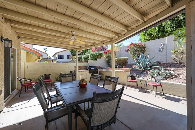 view of patio featuring a ceiling fan, outdoor dining area, and a fenced backyard