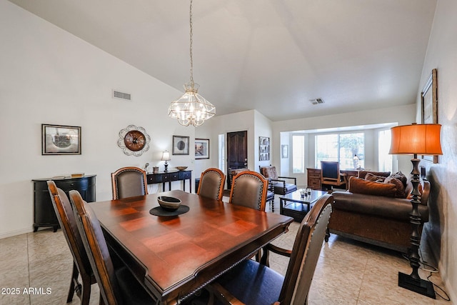 dining room featuring an inviting chandelier, light tile patterned flooring, and visible vents