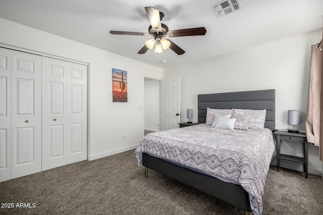 carpeted bedroom with ceiling fan and a closet