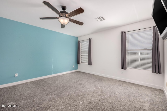 carpeted empty room with ceiling fan