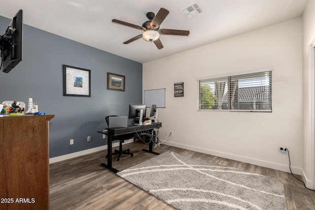 office space with dark hardwood / wood-style floors and ceiling fan