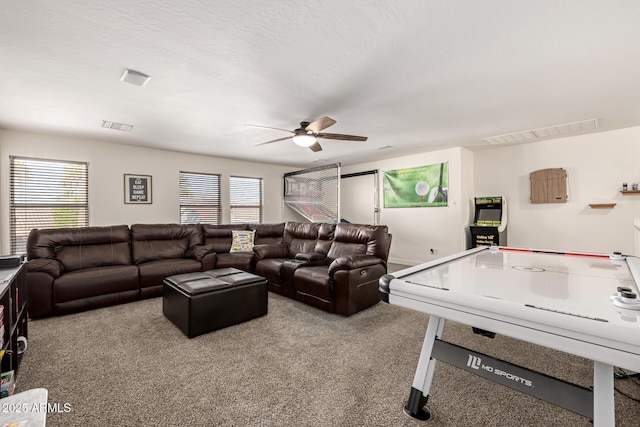 carpeted living room featuring ceiling fan