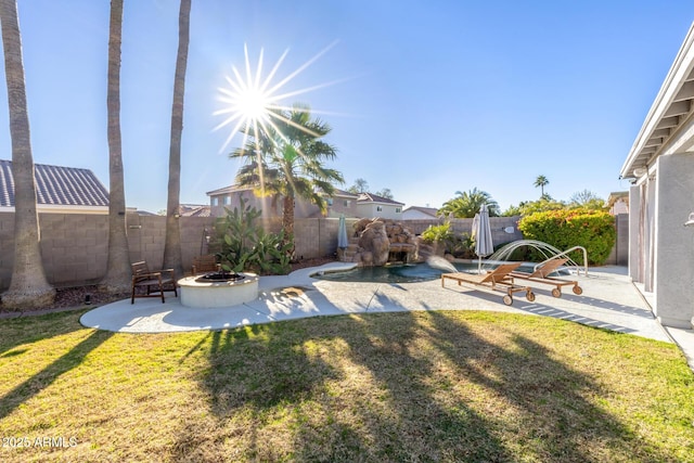 view of yard with a patio and an outdoor fire pit