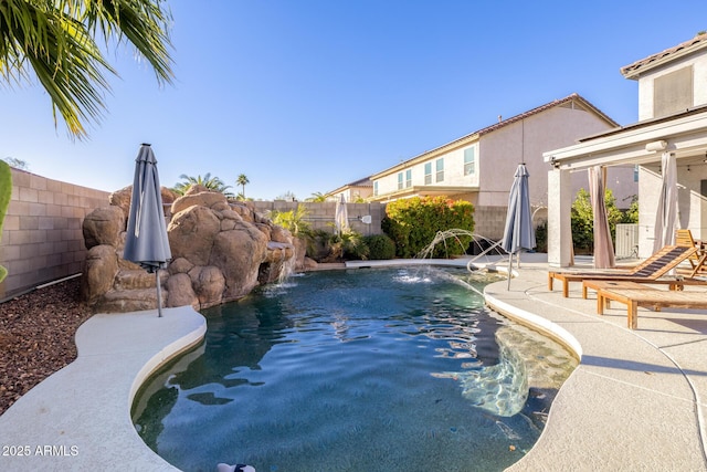 view of swimming pool featuring a patio area and pool water feature