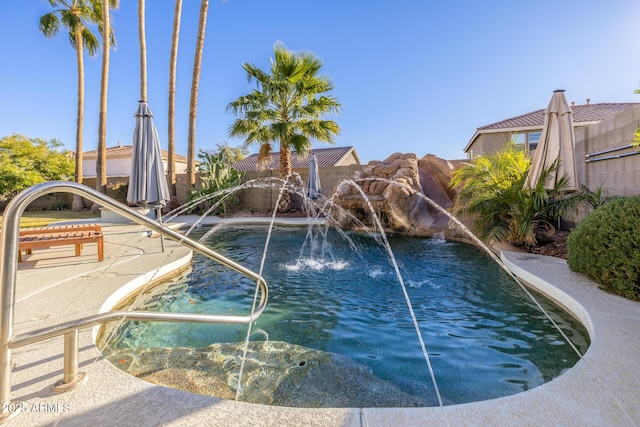 view of pool with pool water feature