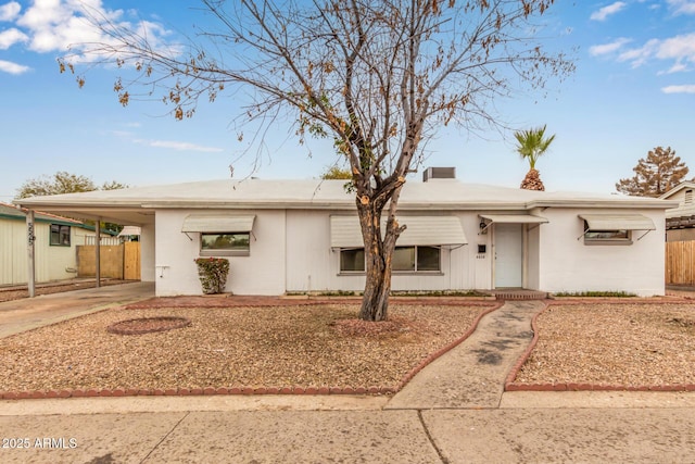 view of front of property featuring a carport