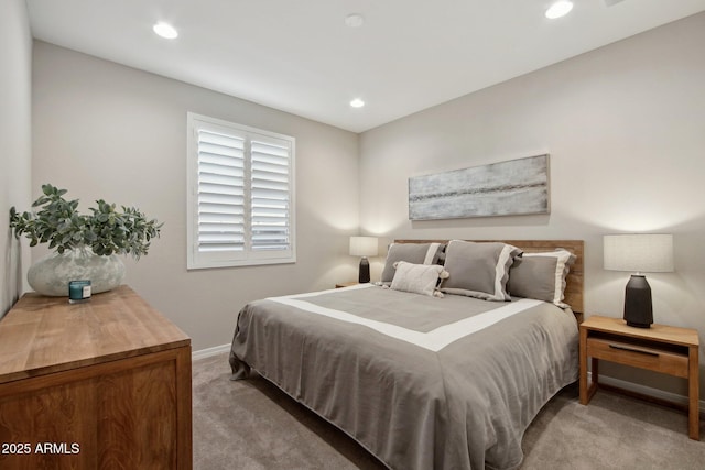 bedroom with light carpet, recessed lighting, and baseboards