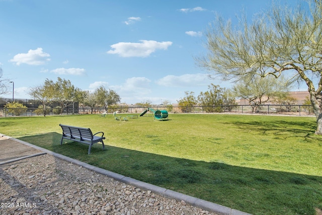 surrounding community featuring a yard and fence