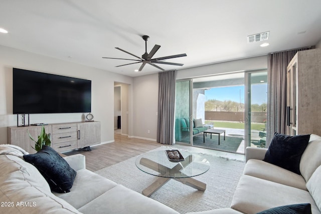 living area with visible vents, ceiling fan, baseboards, recessed lighting, and wood finished floors