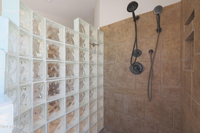 bathroom featuring tiled shower