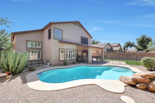 view of swimming pool with a patio area