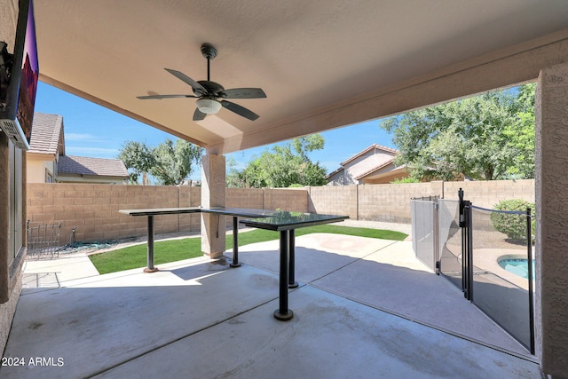 view of patio featuring ceiling fan