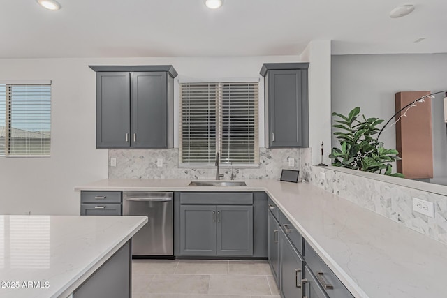 16877 W Butler Ave, Waddell, AZ 85355 - kitchen featuring stainless steel dishwasher, a sink, gray cabinetry, tasteful backsplash, and recessed lighting
