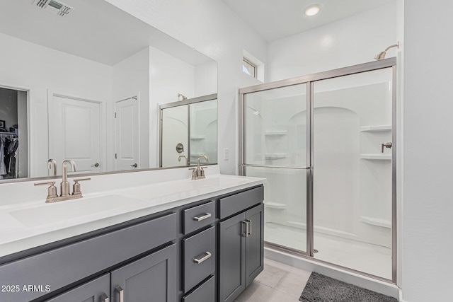 16877 W Butler Ave, Waddell, AZ 85355 - bathroom featuring a shower stall and double vanity