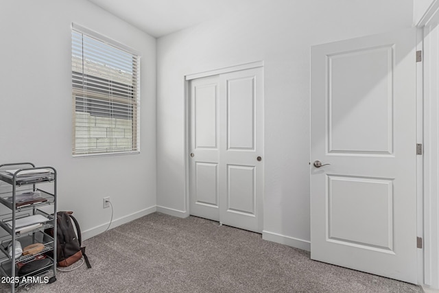 16877 W Butler Ave, Waddell, AZ 85355 - carpeted bedroom featuring baseboards and a closet