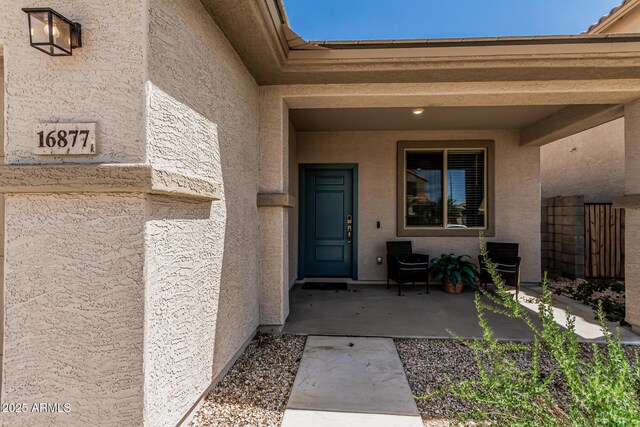 16877 W Butler Ave, Waddell, AZ 85355 - entrance to property featuring stucco siding and a patio