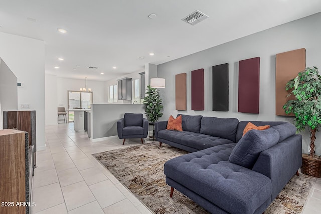 16877 W Butler Ave, Waddell, AZ 85355 - living area featuring recessed lighting, a chandelier, light tile patterned floors, and baseboards