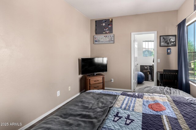 bedroom featuring baseboards