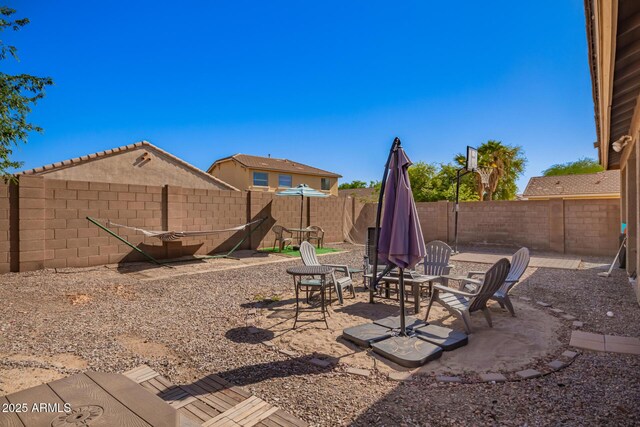 view of yard with a patio area and a fenced backyard