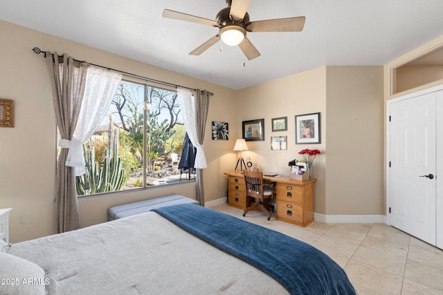 bedroom with baseboards, ceiling fan, and tile patterned flooring