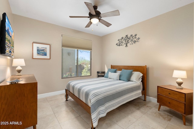 bedroom with light tile patterned flooring, baseboards, and ceiling fan
