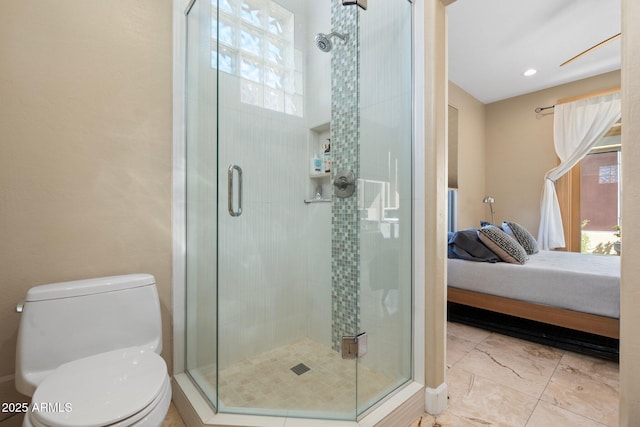 bathroom with a healthy amount of sunlight, ensuite bathroom, and a shower stall
