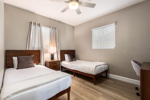 bedroom featuring ceiling fan and light hardwood / wood-style floors