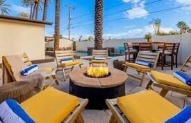 view of patio / terrace with a fire pit