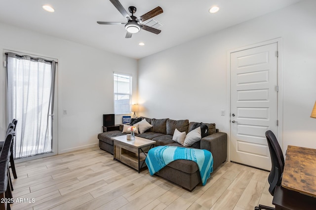 7694 W Desert Spoon Dr, Peoria, AZ 85383 - living room with light wood-style floors, ceiling fan, and recessed lighting