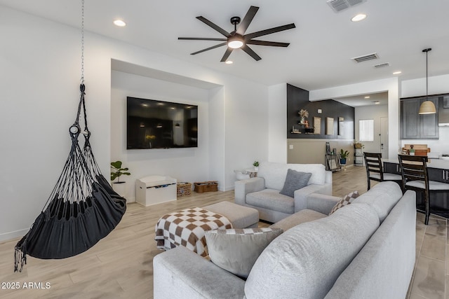 7694 W Desert Spoon Dr, Peoria, AZ 85383 - living area featuring a ceiling fan, recessed lighting, light wood-type flooring, and baseboards