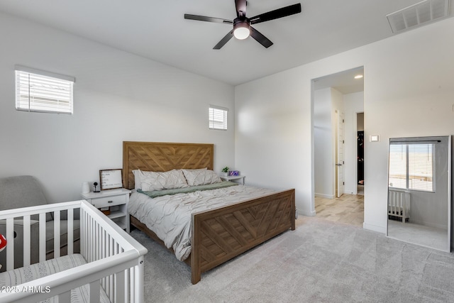 7694 W Desert Spoon Dr, Peoria, AZ 85383 - carpeted bedroom featuring radiator heating unit, baseboards, and ceiling fan