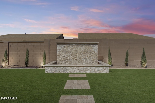 7694 W Desert Spoon Dr, Peoria, AZ 85383 - view of yard at dusk