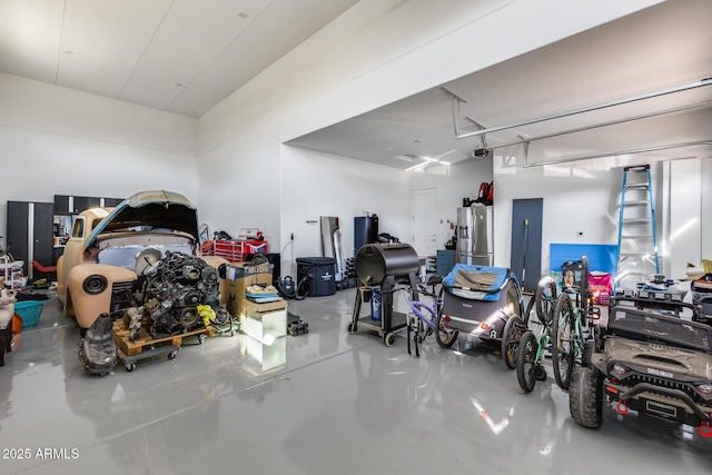 7694 W Desert Spoon Dr, Peoria, AZ 85383 - garage featuring stainless steel fridge and a garage door opener