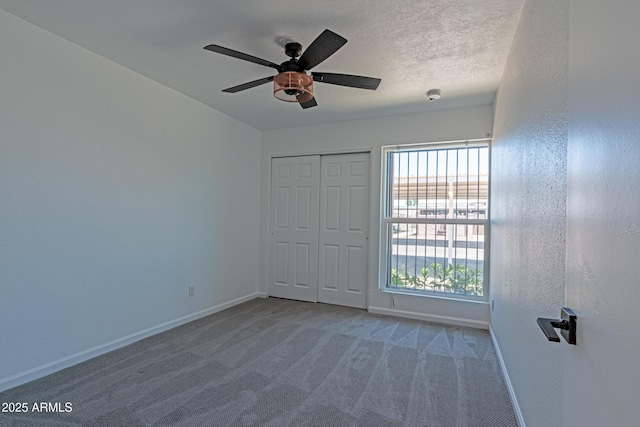 6044 W Augusta Ave, Glendale, AZ 85301 - unfurnished bedroom with baseboards, carpet, a closet, and ceiling fan