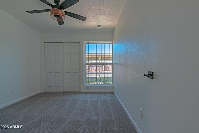 6044 W Augusta Ave, Glendale, AZ 85301 - unfurnished bedroom with baseboards, carpet flooring, a ceiling fan, and a closet