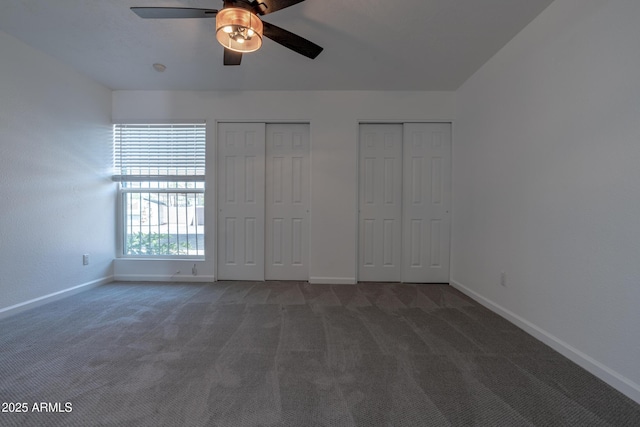 6044 W Augusta Ave, Glendale, AZ 85301 - unfurnished bedroom featuring two closets, baseboards, carpet, and a ceiling fan
