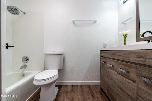 6044 W Augusta Ave, Glendale, AZ 85301 - full bathroom featuring wood finished floors, vanity, toilet, baseboards, and shower / washtub combination
