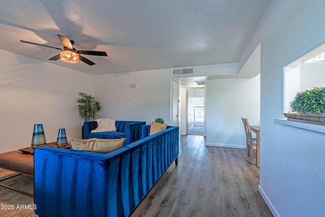 6044 W Augusta Ave, Glendale, AZ 85301 - living area featuring wood finished floors, baseboards, and ceiling fan