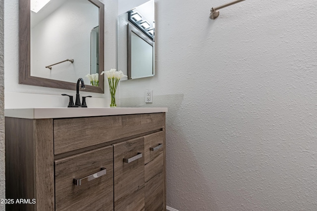 6044 W Augusta Ave, Glendale, AZ 85301 - bathroom featuring vanity and a textured wall