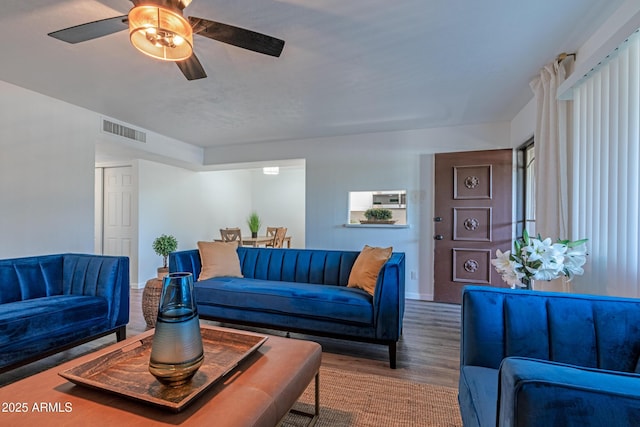 6044 W Augusta Ave, Glendale, AZ 85301 - living room with wood finished floors, baseboards, and ceiling fan