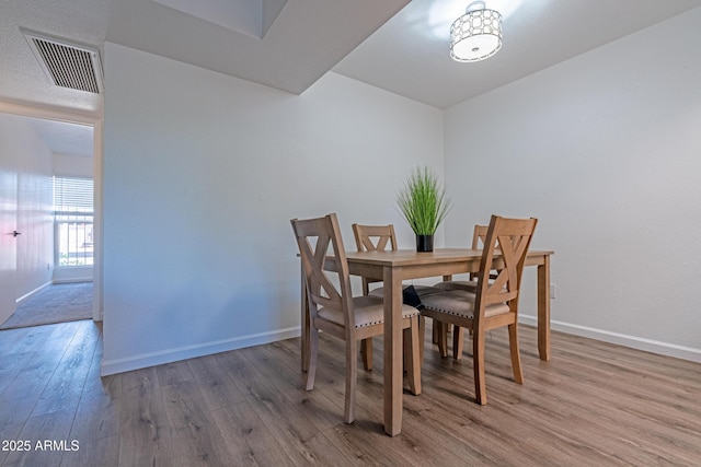 6044 W Augusta Ave, Glendale, AZ 85301 - dining space with wood finished floors and baseboards