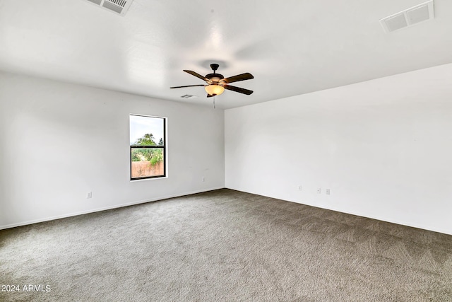 spare room featuring carpet flooring and ceiling fan