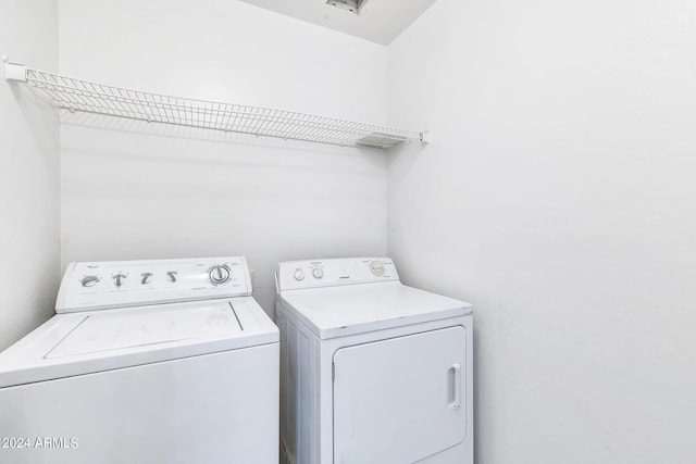 washroom featuring separate washer and dryer